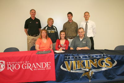 Teays Valley High's Katie Glover is joined by her parents and coaches after signing with Rio Grande
